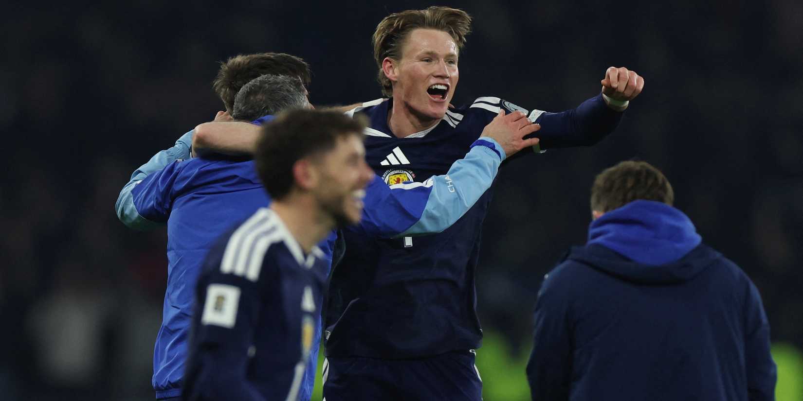 Scotland's Scott McTominay with teammates celebrate after they qualify for the World Cup