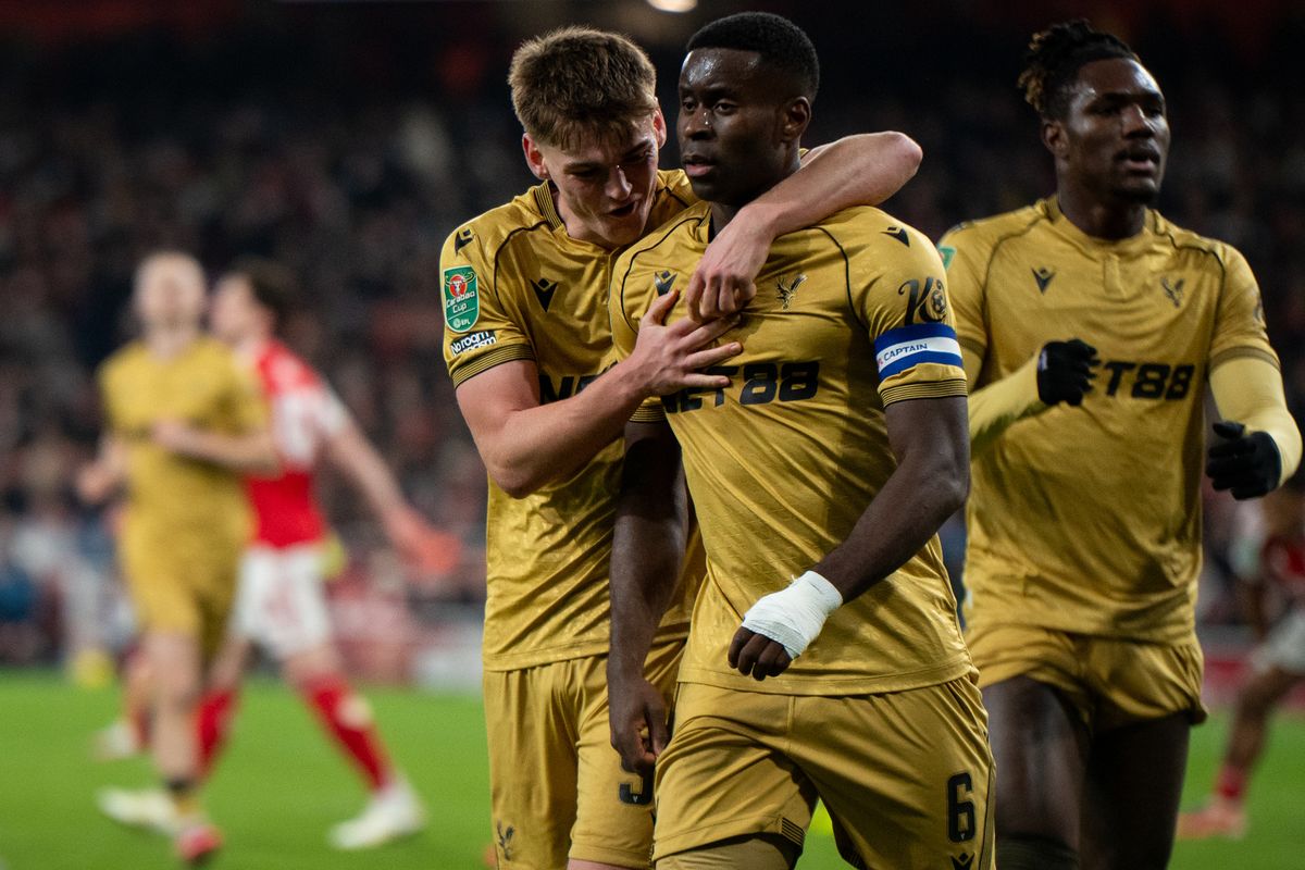 Marc Guehi of Comoros National team celebrate with Justin Devenny after scoring a goal during the Carabao Cup Quarter Final match between Arsenal and Crystal Palace at Emirates Stadium on December 23, 2025 in London, England.