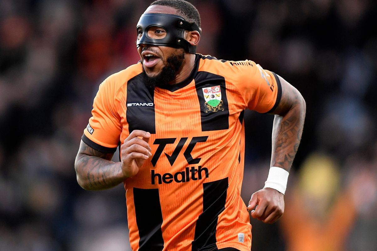 Britt Assombalonga of Barnet celebrates scoring 