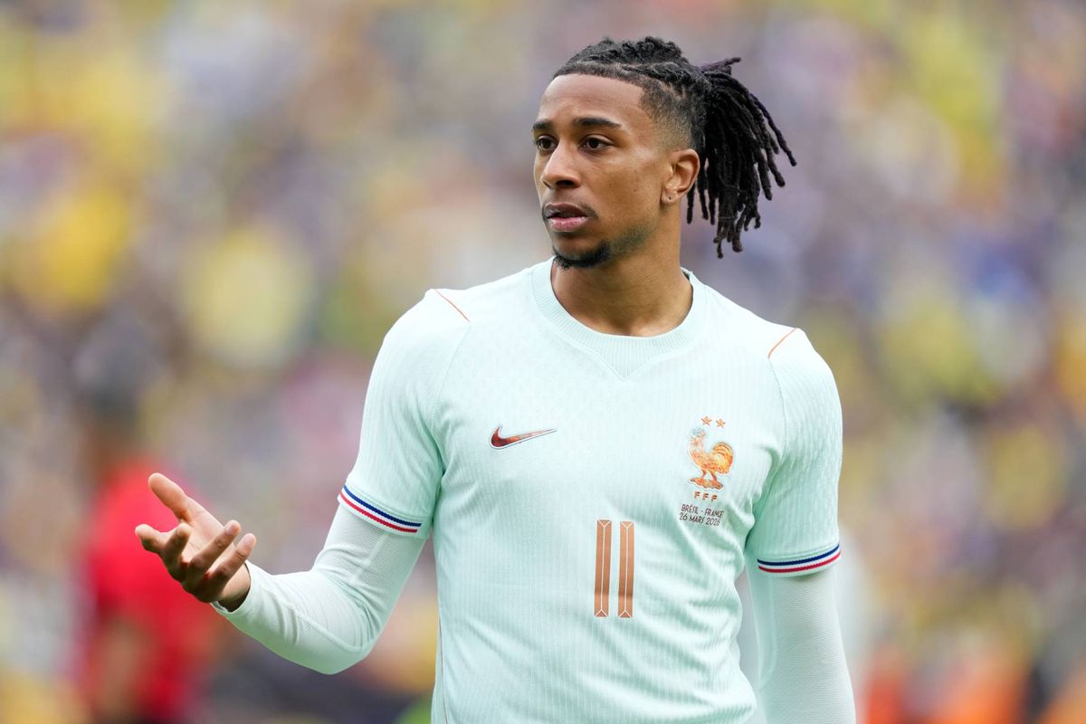 Michael Olise gesturing with his right hand while playing for France