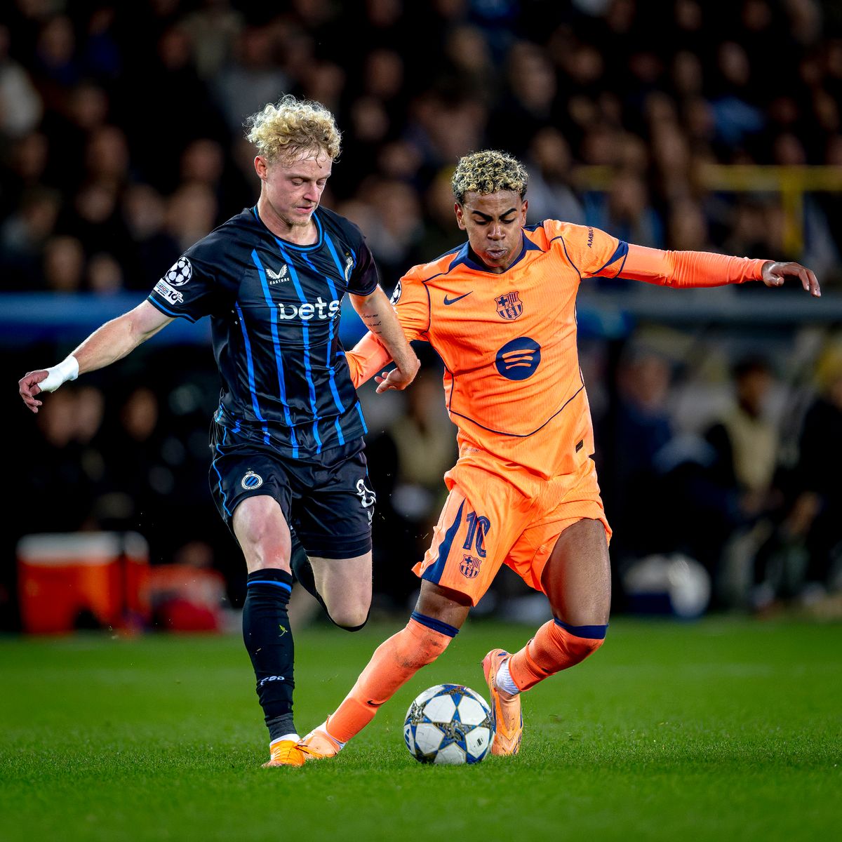 Club Brugge midfielder Joaquin Seys and FC Barcelona forward Lamine Yamal