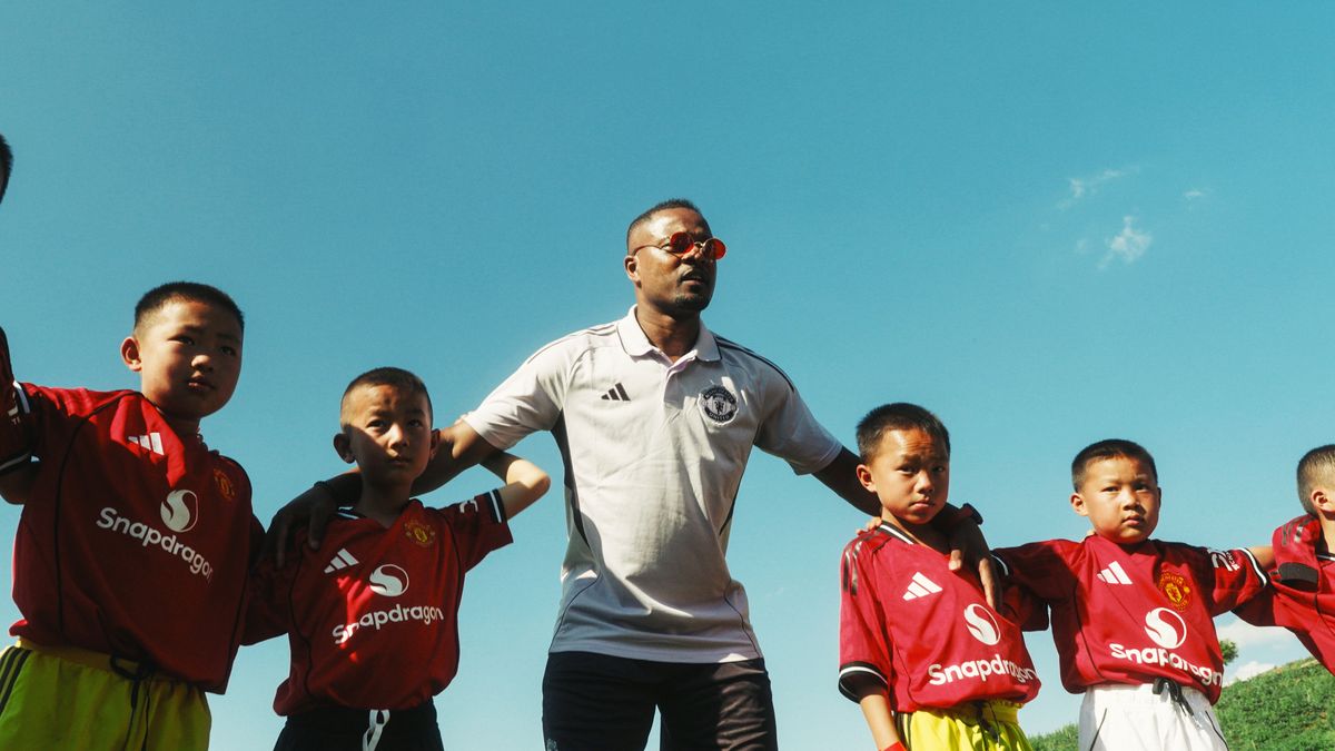 Patrice Evra delivers a coaching session in Mae Suek