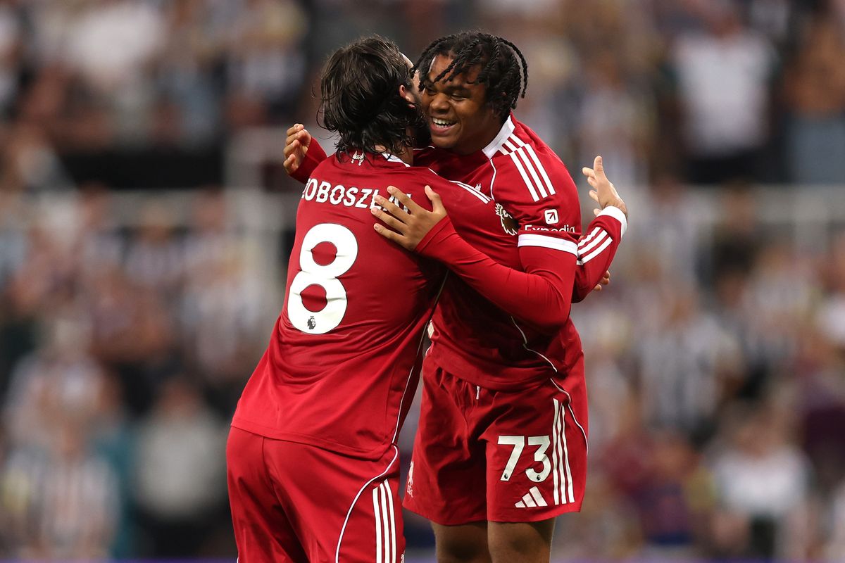 NEWCASTLE UPON TYNE, ENGLAND - AUGUST 25: Rio Ngumoha of Liverpool celebrates with teammate Dominik Szoboszlai after scoring his team's third goal during the Premier League match between Newcastle United and Liverpool at St James' Park on August 25, 2025 in Newcastle upon Tyne, England. (Photo by George Wood/Getty Images)