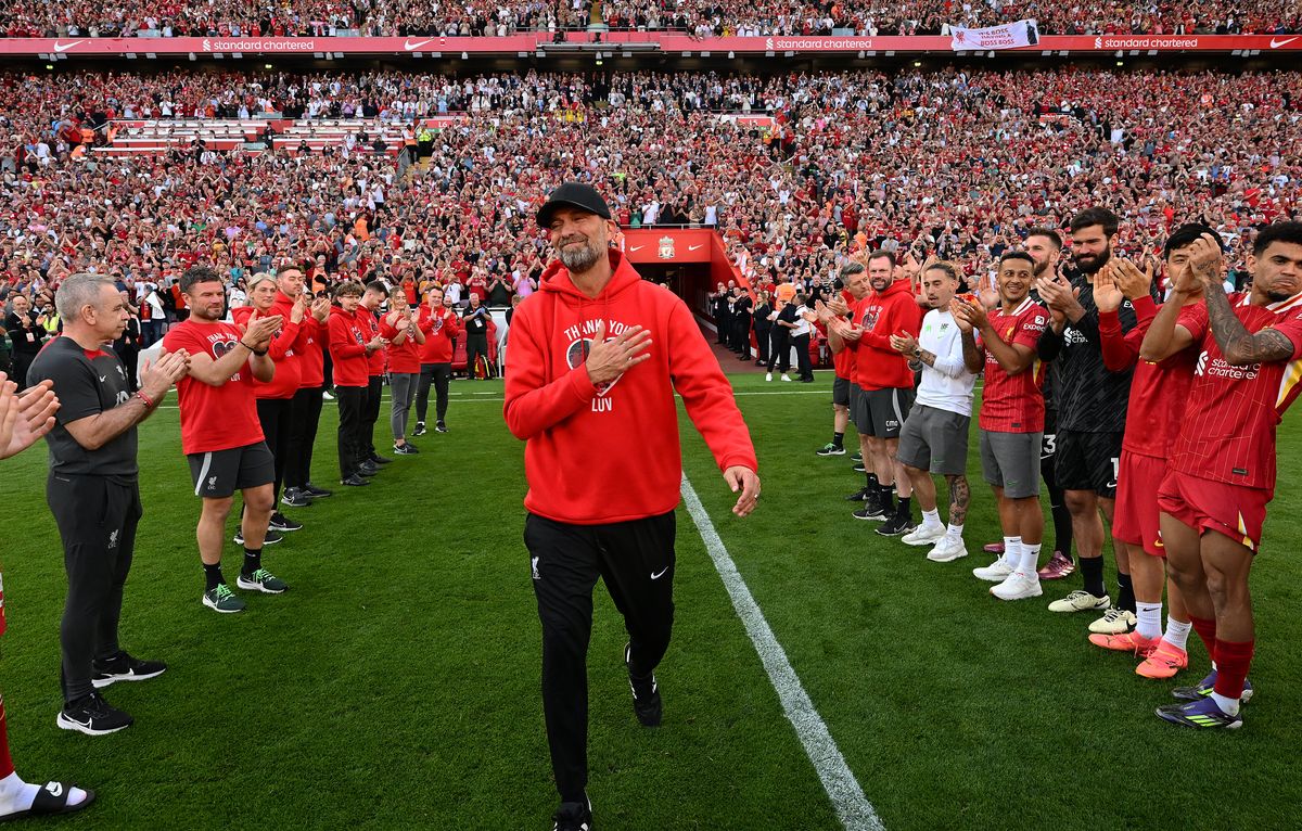 Jurgen Klopp manager of Liverpool walks his "Guard of Honour" at the end the Premier League match between Liverpool FC and Wolverhampton Wanderers at Anfield on May 19, 2024 in Liverpool, England. 