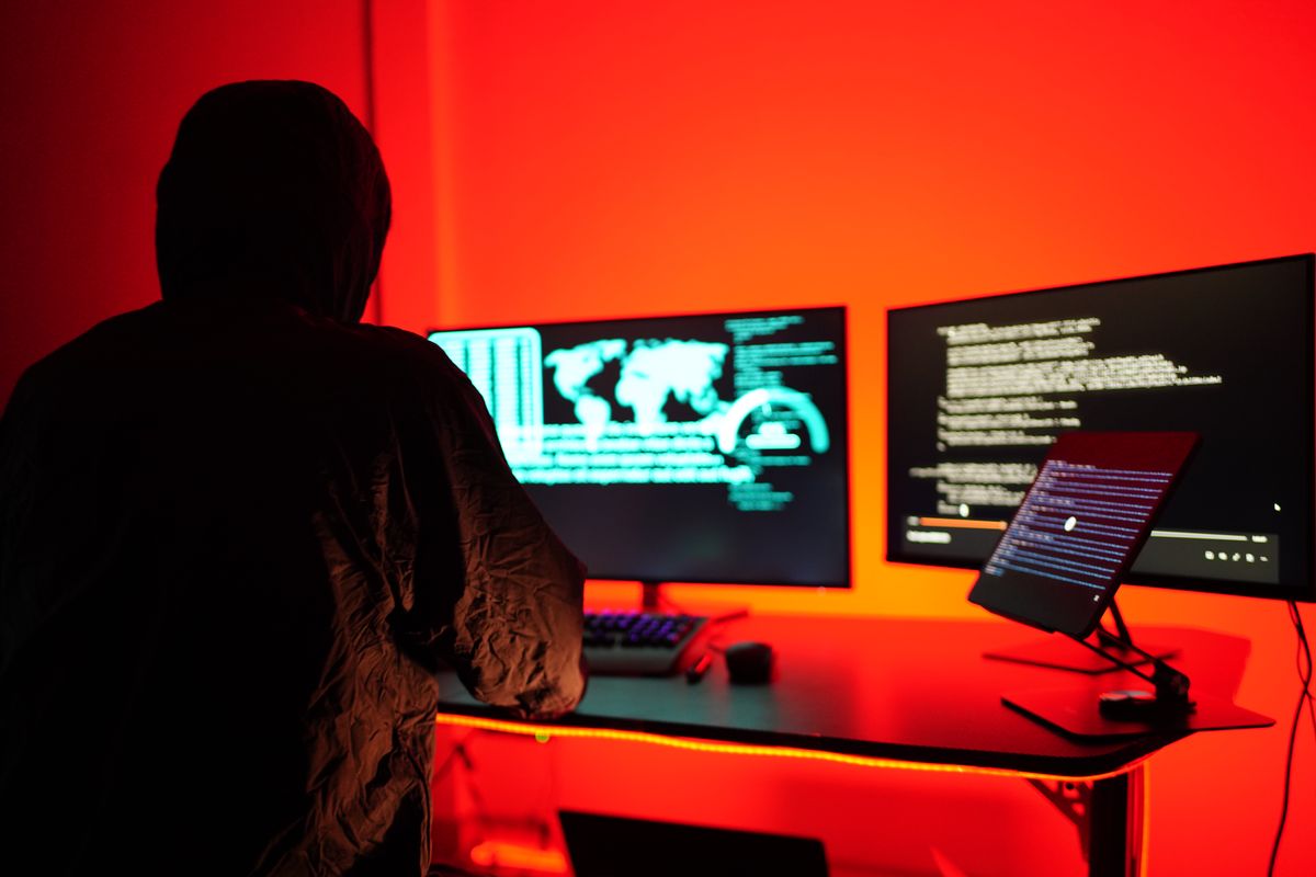 Hackers work secretly in secret rooms. Mysterious colored lights Breaking into personal security and various agencies in the world . Wanted Hacker using computer for hacking in the cyber data center .
