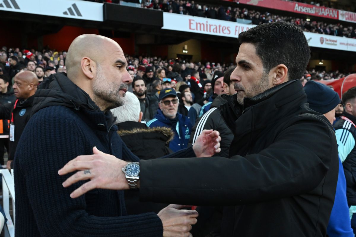  Pep Guardiola, Manager of Manchester City, embraces Mikel Arteta, Manager of Arsenal, prior to the Premier League match between Arsenal FC and Manchester City FC