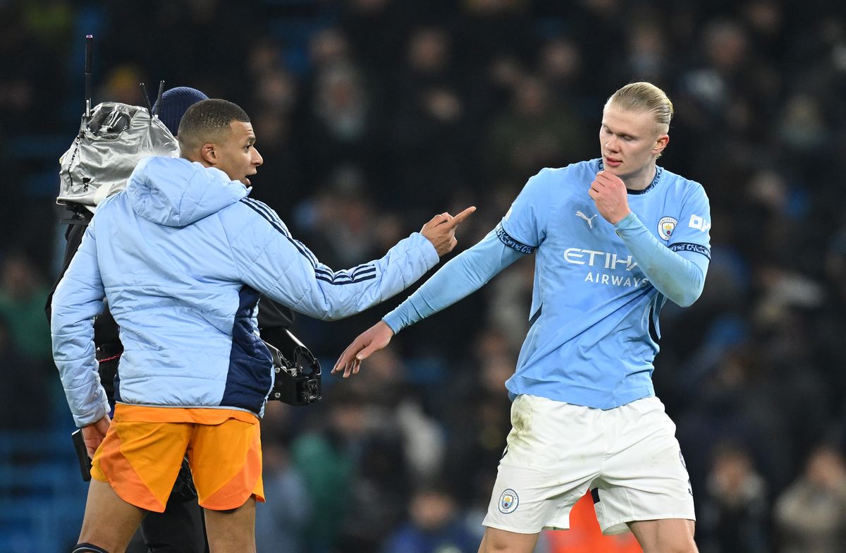 Kylian Mbappe of Real Madrid speaks with Erling Haaland of Manchester City after the UEFA Champions League 2024/25 League Knockout Play-off first leg match between Manchester City and Real Madrid C.F. at Manchester City Stadium on February 11, 2025 in Manchester, England. 