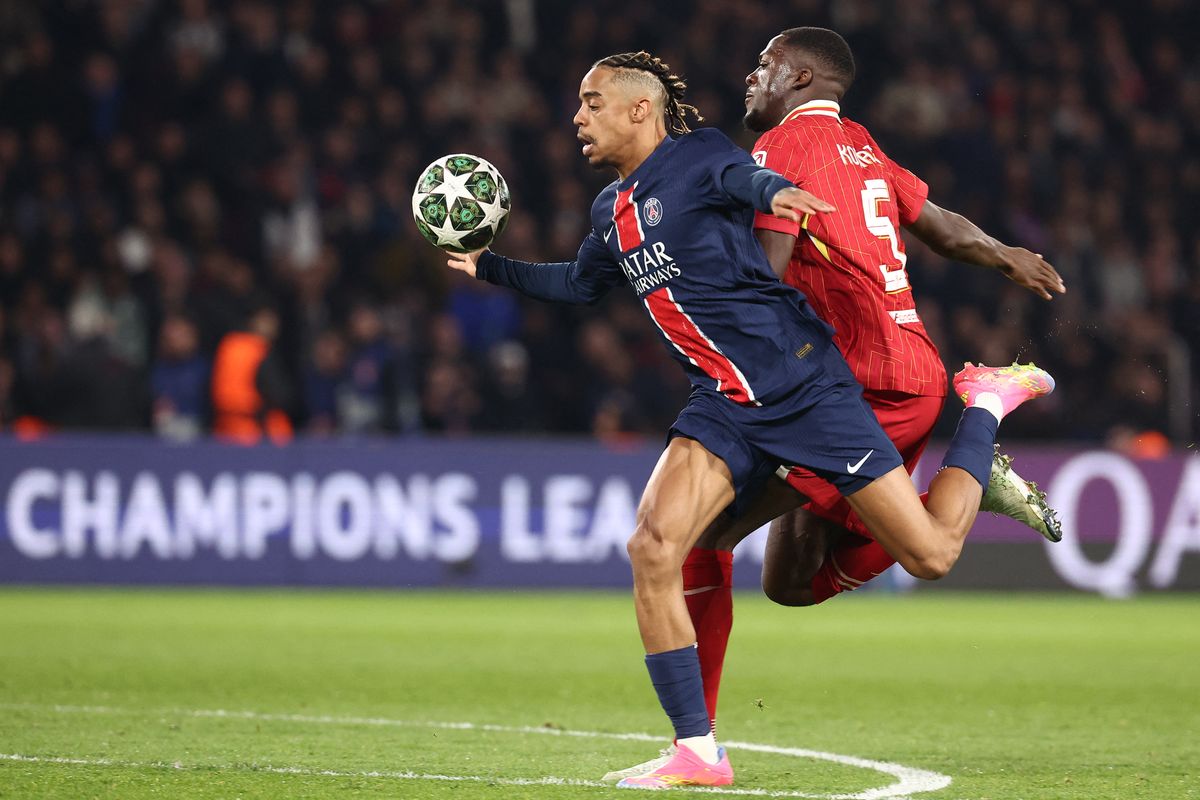 Paris Saint-Germain's French forward #29 Bradley Barcola (L) and Liverpool's French defender #05 Ibrahima Konate (R) fight for the ball during the UEFA Champions League Round of 16 first leg football match between Paris Saint-Germain (FRA) and Liverpool (ENG) at the Parc des Princes stadium in Paris on March 5, 2025. (Photo by FRANCK FIFE / AFP) (Photo by FRANCK FIFE/AFP via Getty Images) 