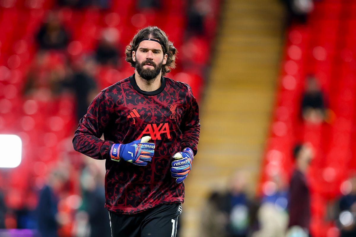 Alisson warms up