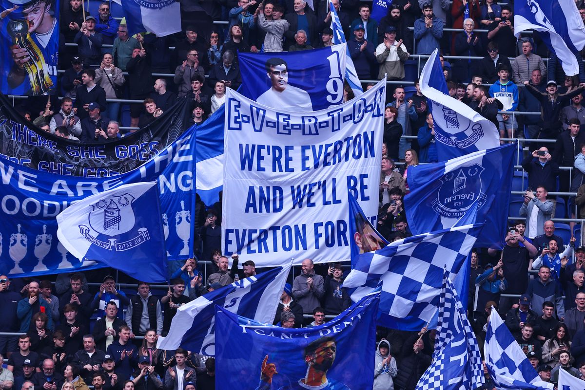 Fans of Everton wave flags and banners during the Premier League match between Everton and Chelsea.Photo by Robbie Jay Barratt - AMA/Getty Images