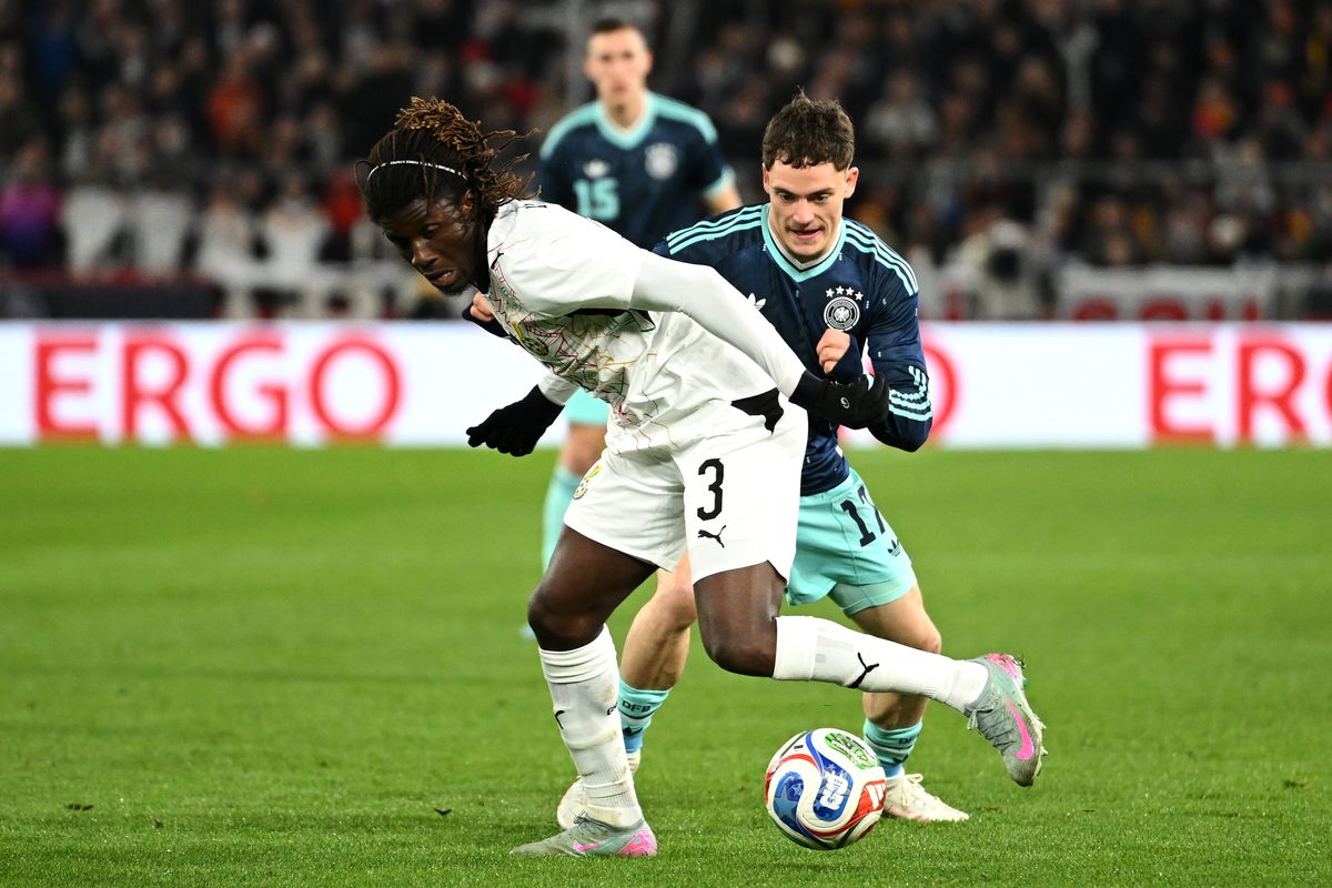 Caleb Yirenkyi of Ghana battles for the ball with Florian Wirtz of Germany during the international friendly match between Germany and Ghana at MHP Arena on March 30, 2026 in Ludwigsburg, Germany