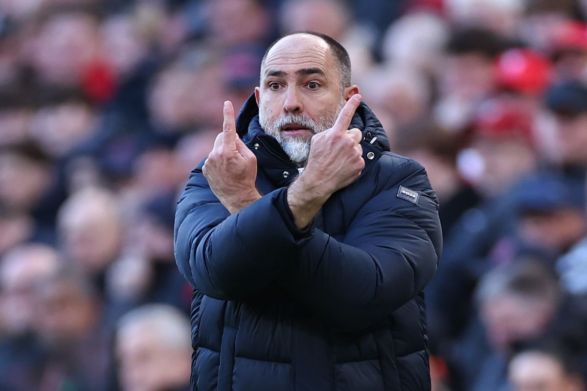 Igor Tudor crosses both arms on his chest with each index finger raised