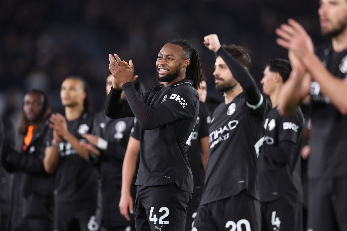 Manchester City players celebrate after a game