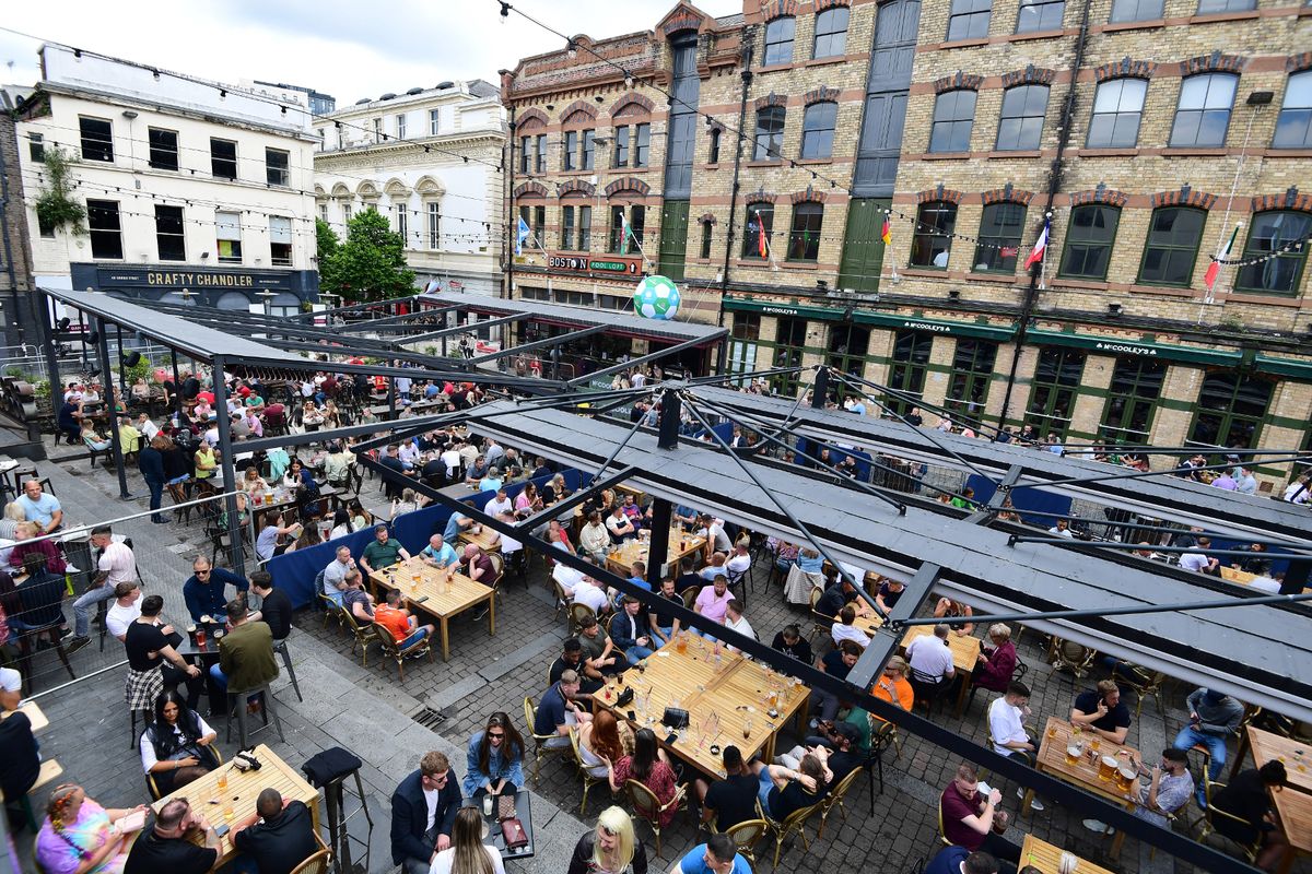 People enjoying a drink in Concert Square.