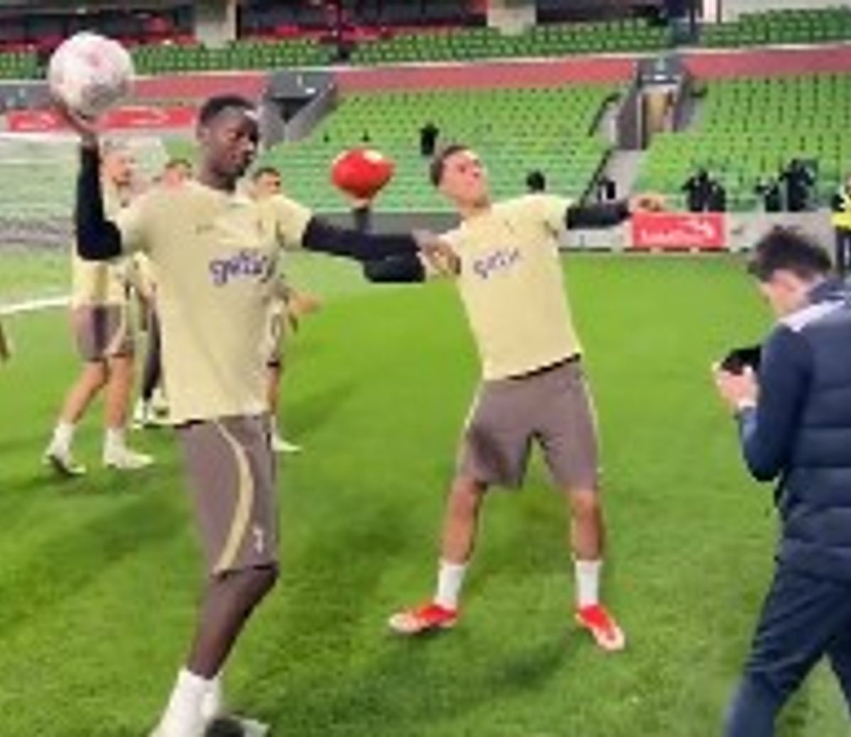 Brennan Johnson throwing an AFL football