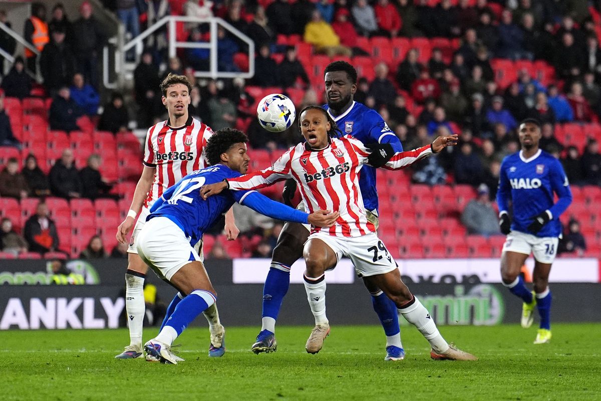 Ipswich pair Cedric Kipre and Jens Cajuste get their hands on Lamine Cisse to concede a late penalty for Stoke City.