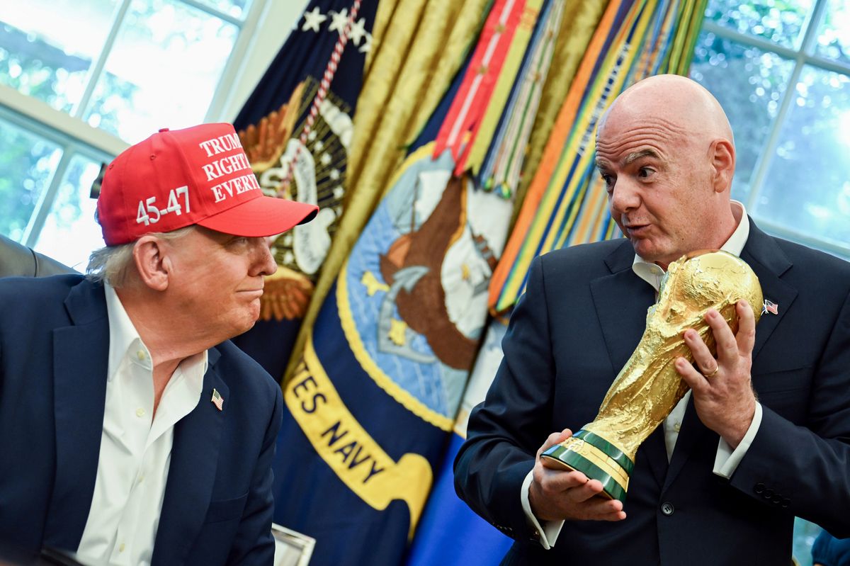 US President Donald Trump, left, and Gianni Infantino, president of the Federation International Football Association (FIFA), with the FIFA World Cup trophy in the Oval Office of the White House