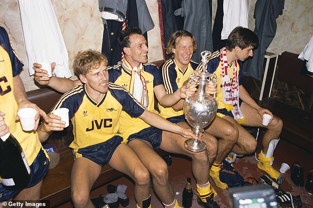 The Arsenal dressing room celebrate their famous victory at Anfield in 1989, which sealed the First Division. 'None of us expected to win,' admits Graham