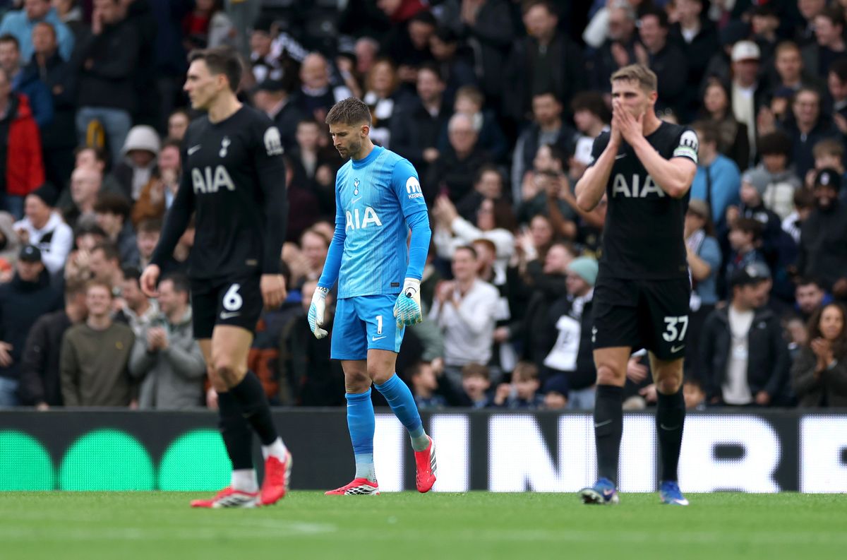 Dejected Tottenham Hotspur players react