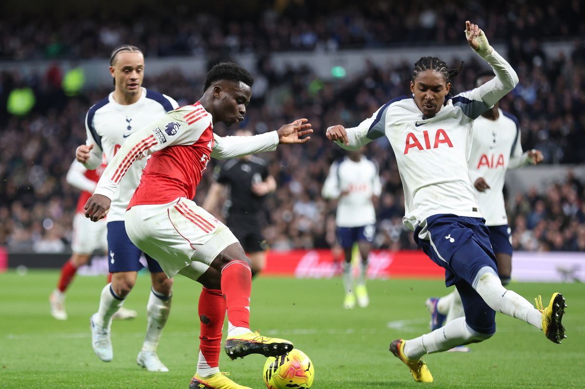 Arsenal and Tottenham players in action 
