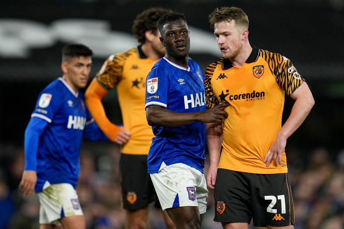 Eazor Matusiwa of Ipswich Town grapples with Joe Gelhardt of Hull City