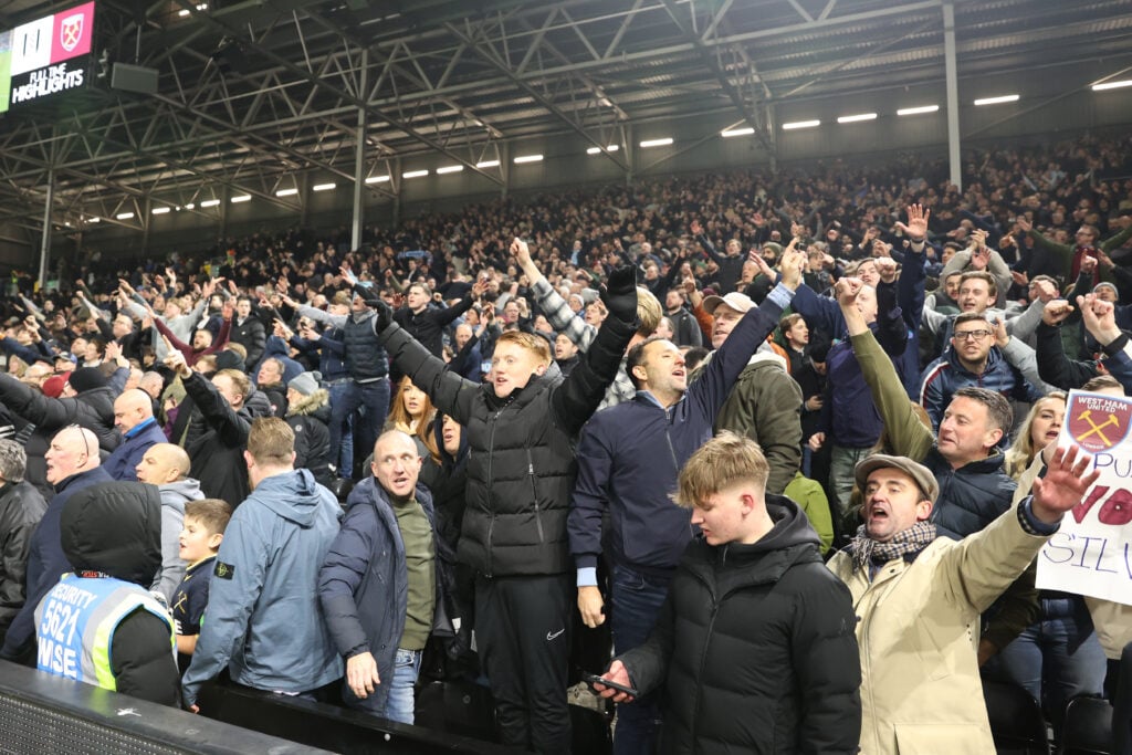 West Ham United supporters celebrate the victory over Fulham at Craven Cottage