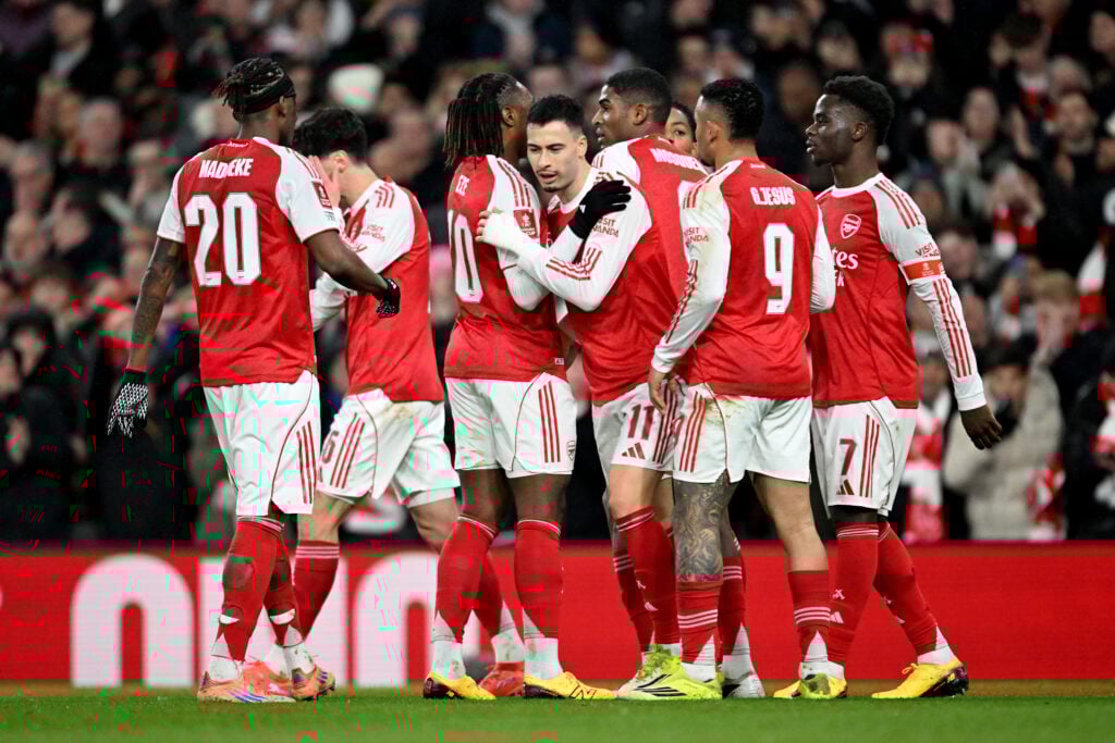 Arsenal players celebrate a goal in the FA Cup against Wigan Athletic at the Emirates Stadium
