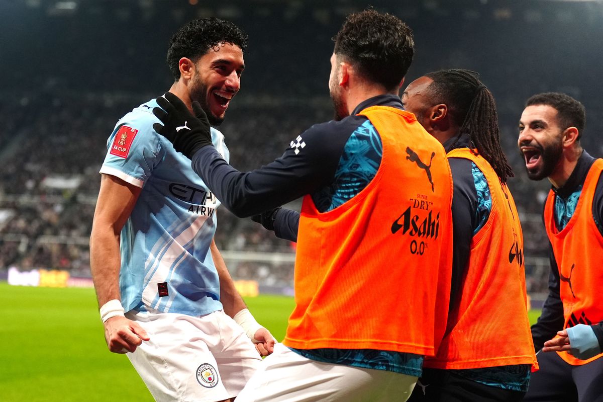 Omar Marmoush (left) celebrates scoring for Manchester City