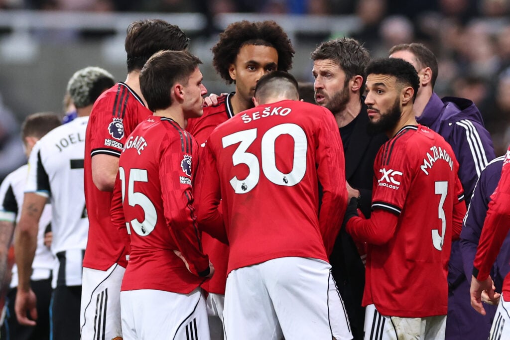 Michael Carrick instructs his players during the Premier League match between Newcastle United and Manchester United at St James’ Park in 2026 in Newcastle upon Tyne, England.