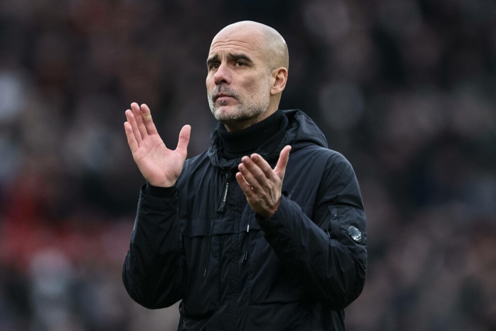 Manchester City manager Pep Guardiola applauds after a game.