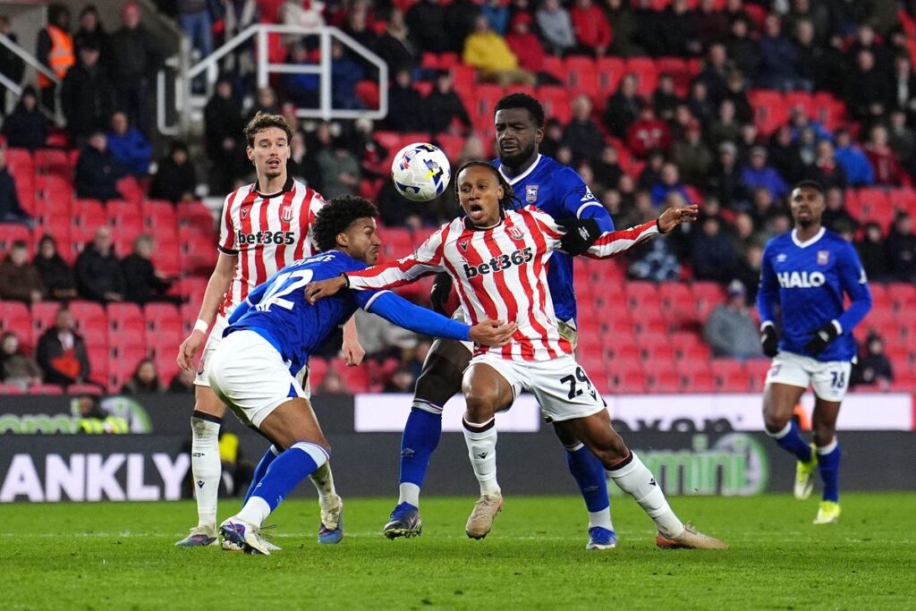 Ipswich pair Cedric Kipre and Jens Cajuste get their hands on Lamine Cisse to concede a late penalty for Stoke City.