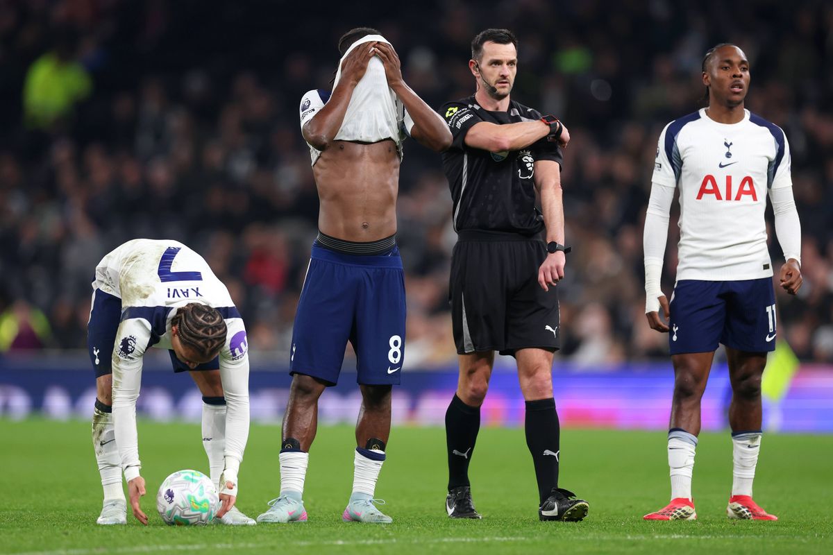 Yves Bissouma of Tottenham Hotspur reacts as Xavi Simons of Tottenham Hotspur prepares to take a free kick during the Premier League match between Tottenham Hotspur and Crystal Palace