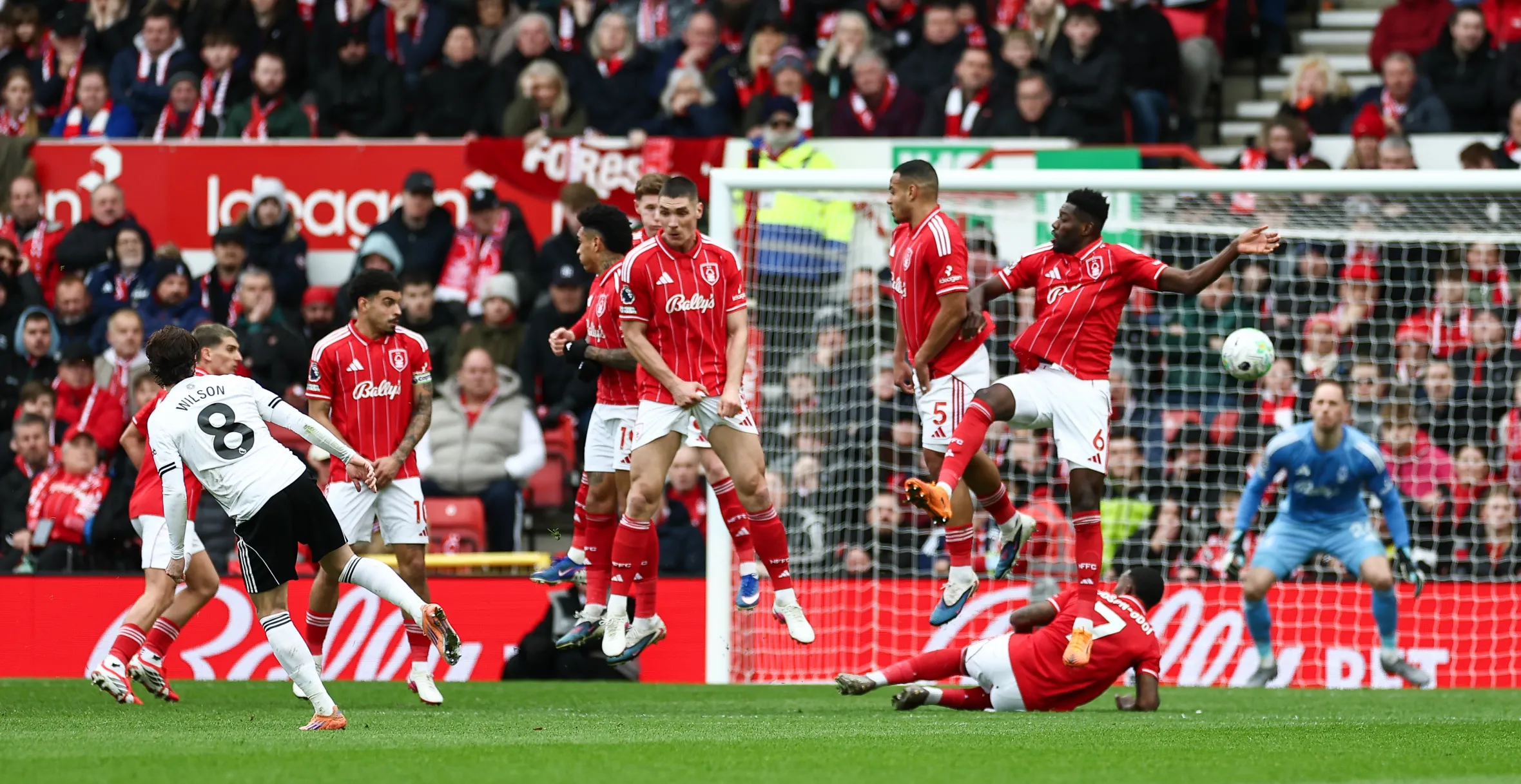 Fulham's Harry Wilson (no. 8) shoots at goal from a free kick during the Premier League match between Nottingham Forest and Fulham.