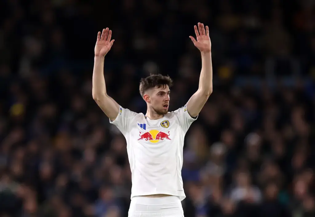 Leeds United midfielder Anton Stach holds both his hands up to signal before taking a free-kick