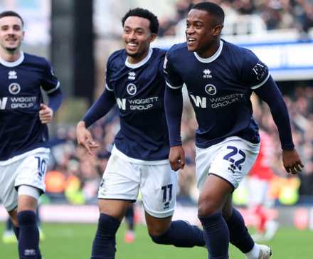 Millwall's Aidomo Emakhu celebrates scoring their fourth goal with Millwall's Femi Azeez