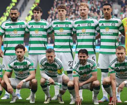 Celtic players pose for a team group photo before the match