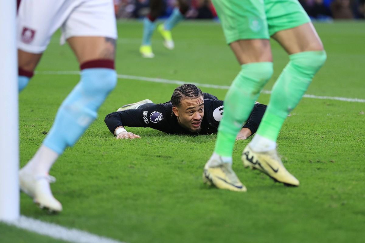 Xavi Simons of Tottenham Hotspur lies dejected during the Premier League match between Burnley and Tottenham Hotspur at Turf Moor