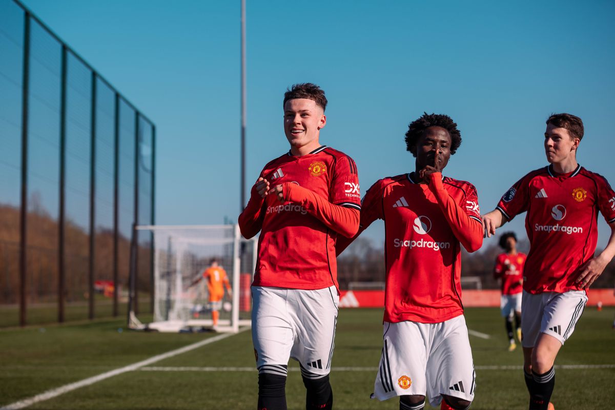 Kai Rooney celebrates with his team-mates