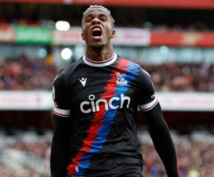Zaha celebrates a goal