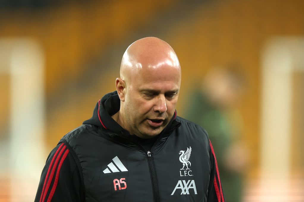 Arne Slot looks down after the game against Wolves