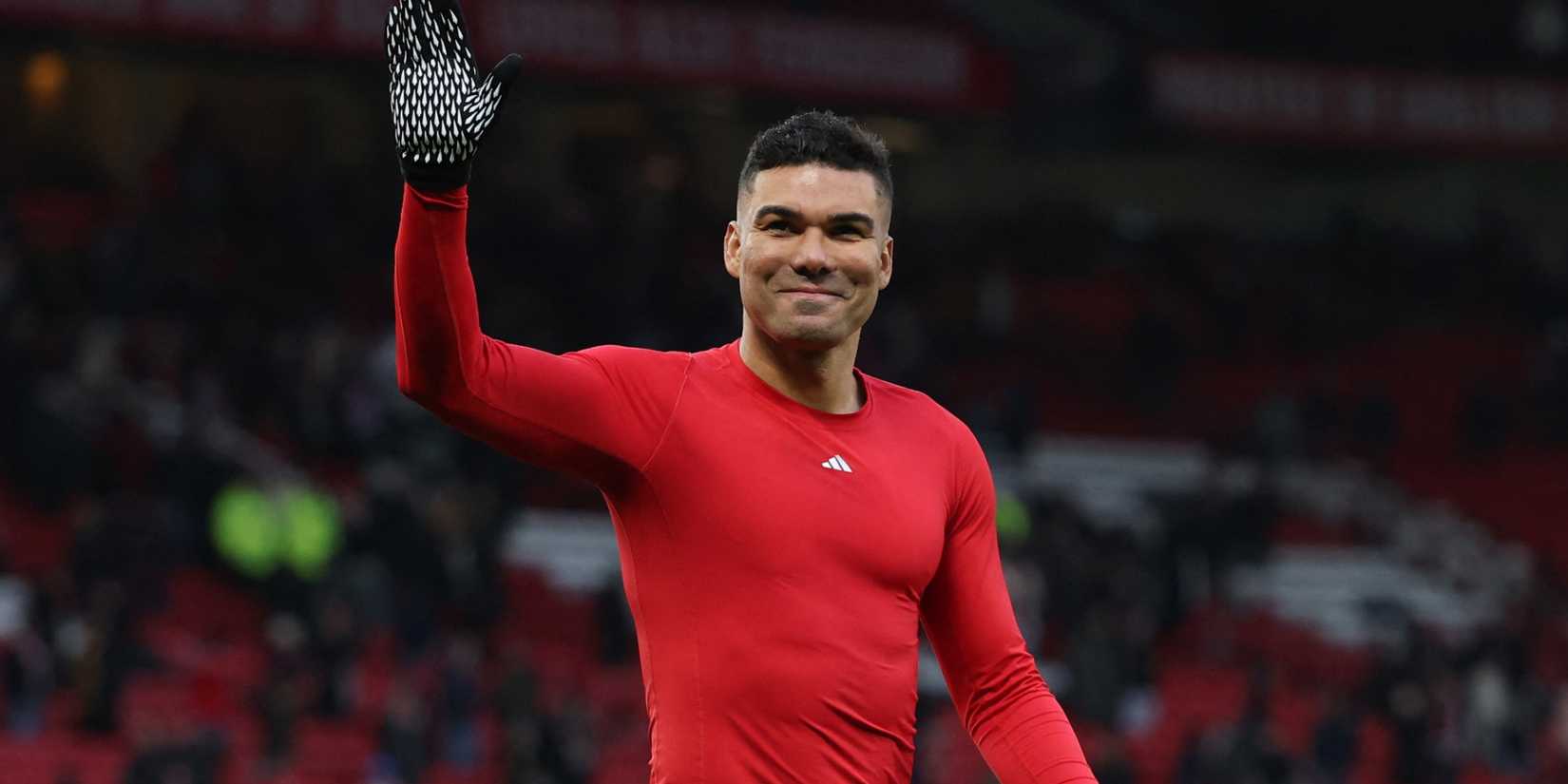 Manchester United midfielder Casemiro waves at fans