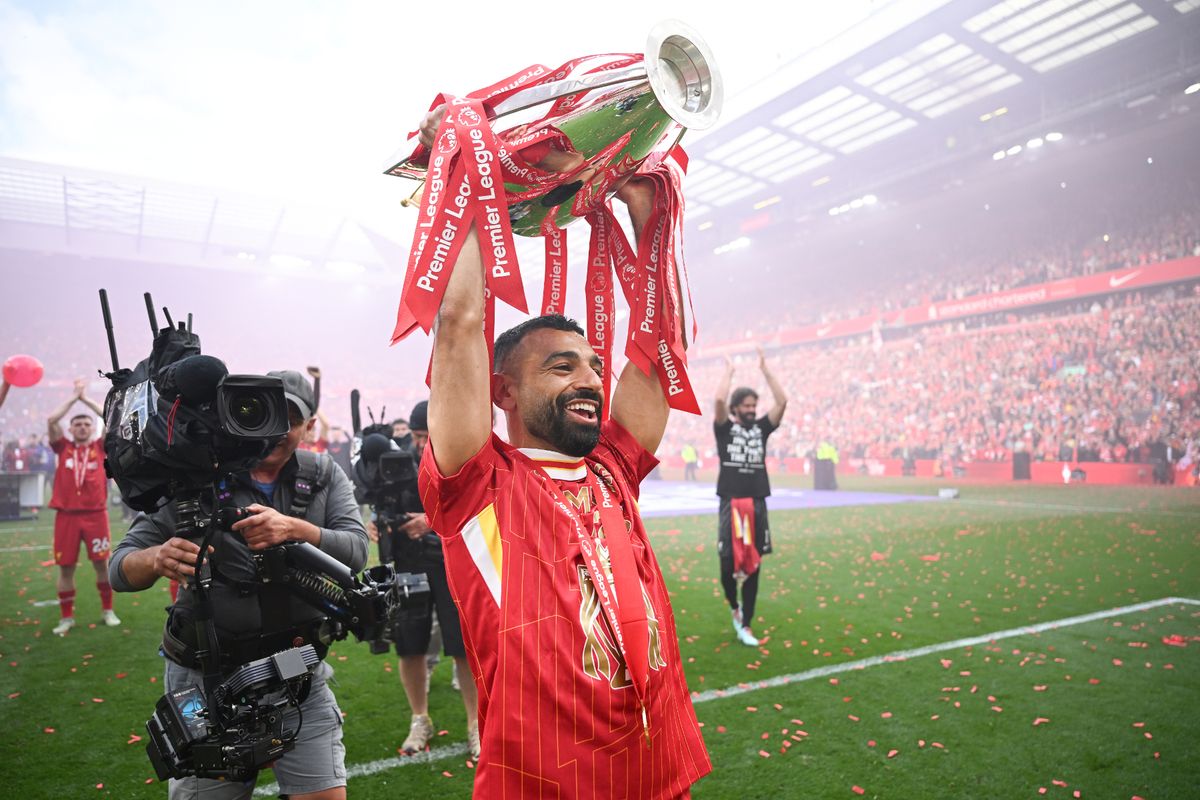 Mohamed Salah lifts the trophy to the fans after the Premier League match between Liverpool FC and Crystal Palace FC at Anfield.