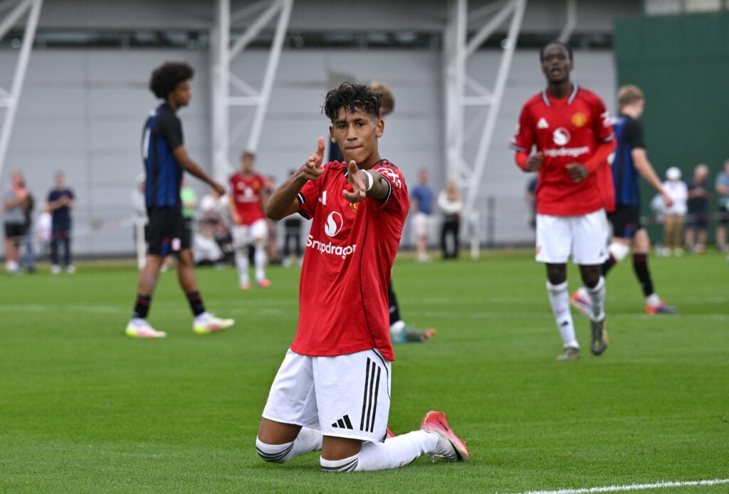 JJ Gabriel celebrates, in Man Utd red kit