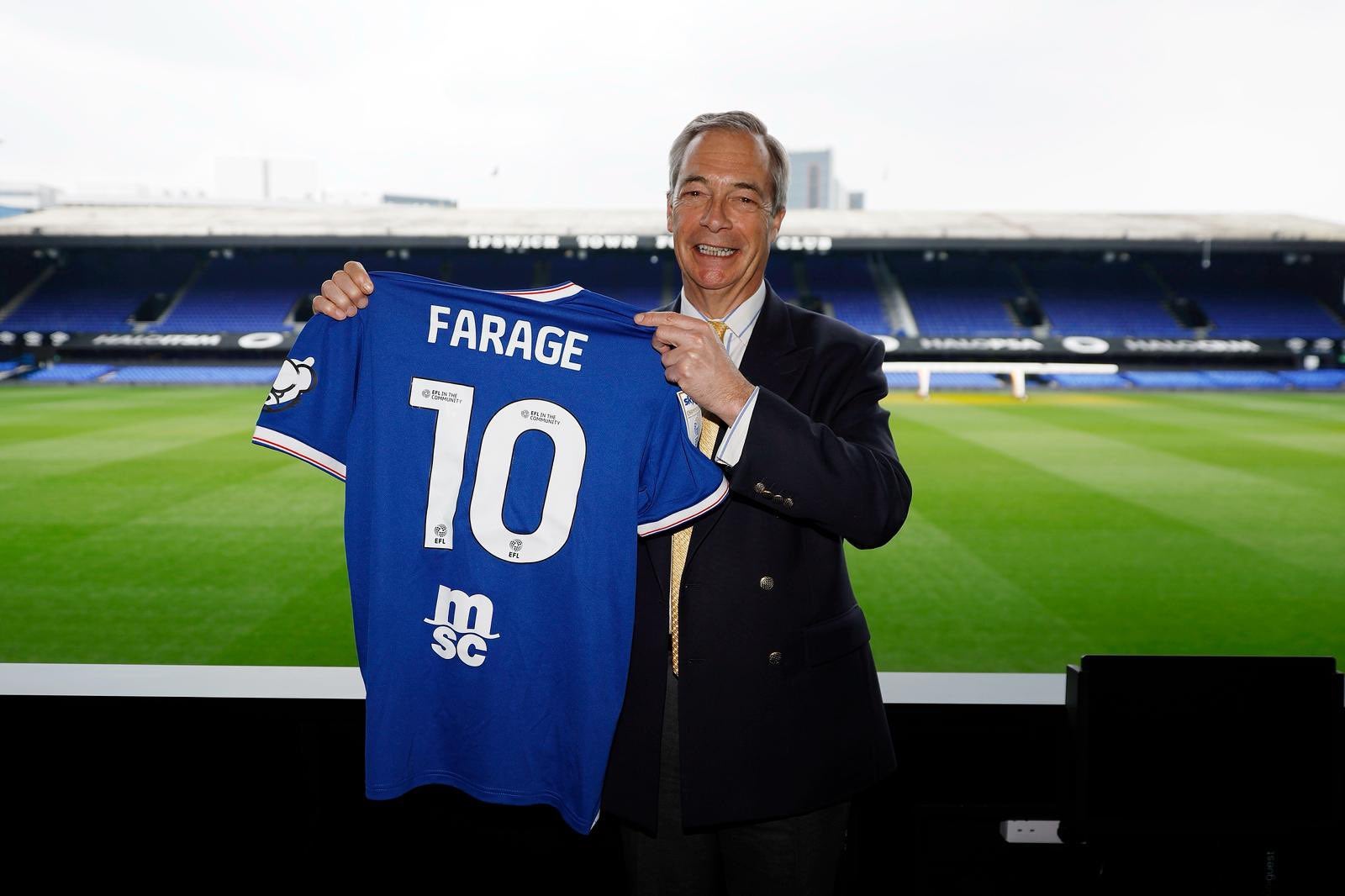 Nigel Farage posed with a '10' shirt at Portman Road