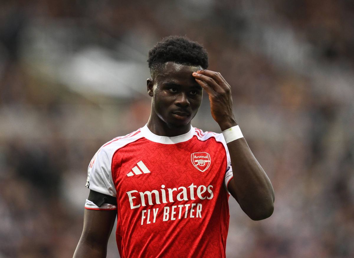 Bukayo Saka of Arsenal touches his head against Newcastle