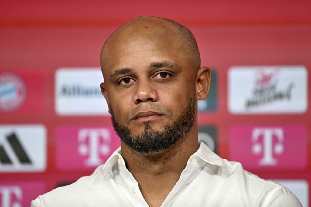 Manchester City-linked manager Vincent Kompany sits in a press conference for Bayern Munich.