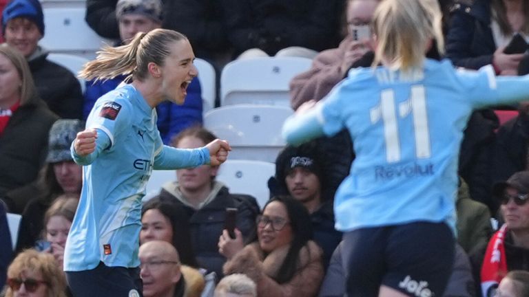 Vivianne Miedema (left) celebrates scoring the opening goal in the Manchester derby