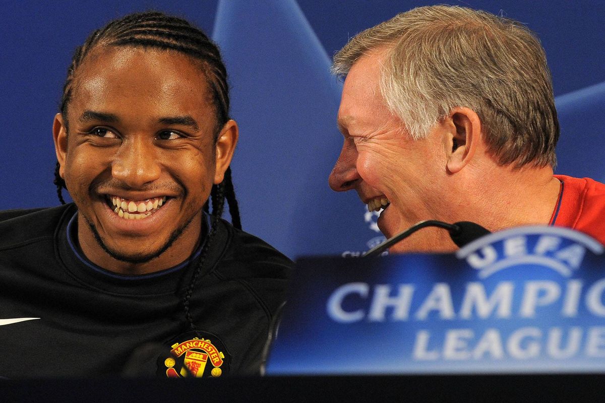 Manchester United manager Alex Ferguson (R) jokes with Manchester United's Brazilian midfielder Anderson during a press conference at the Estádio do Dragão in Porto, Portugal, on April 14, 2009 on the eve of their UEFA Champions league quarter final second leg football match against Porto. AFP PHOTO/ANDREW YATES (Photo by ANDREW YATES / AFP via Getty Images)