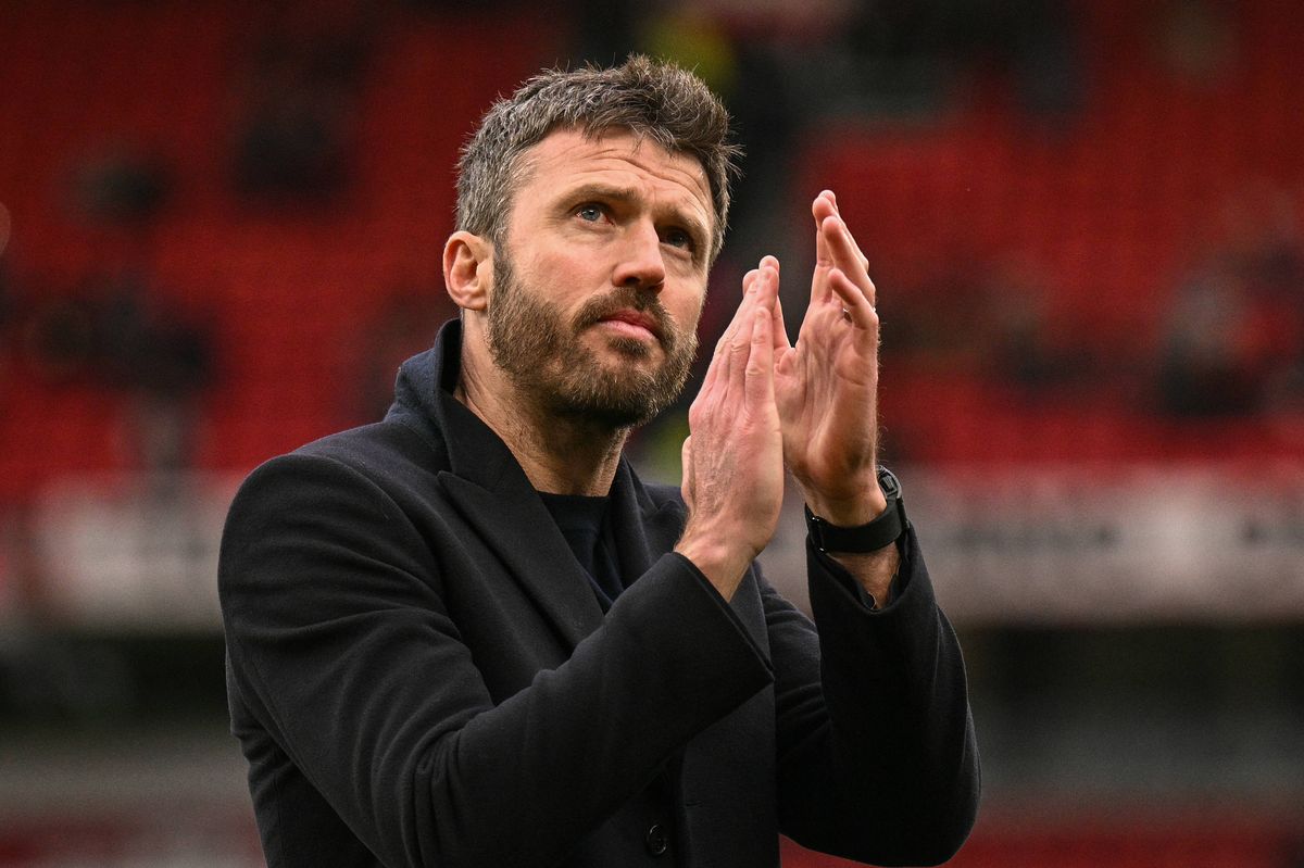 Manchester United's English interim head coach Michael Carrick applauds fans at the end of the English Premier League football match between Manchester United and Aston Villa at Old Trafford in Manchester, north west England, on March 15, 2026. (Photo by Oli SCARFF / AFP via Getty Images) / RESTRICTED TO EDITORIAL USE. No use with unauthorized audio, video, data, fixture lists, club/league logos or 'live' services. Online in-match use limited to 120 images. An additional 40 images may be used in extra time. No video emulation. Social media in-match use limited to 120 images. An additional 40 images may be used in extra time. No use in betting publications, games or single club/league/player publications. / 