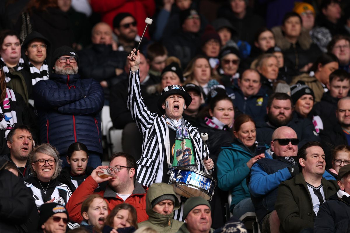  A fan of Newcastle uses a drum in the stands while wearing fancy dress prior to the Barclays Women's Super League 2 match between Sunderland and Newcastle United at Stadium of Light
